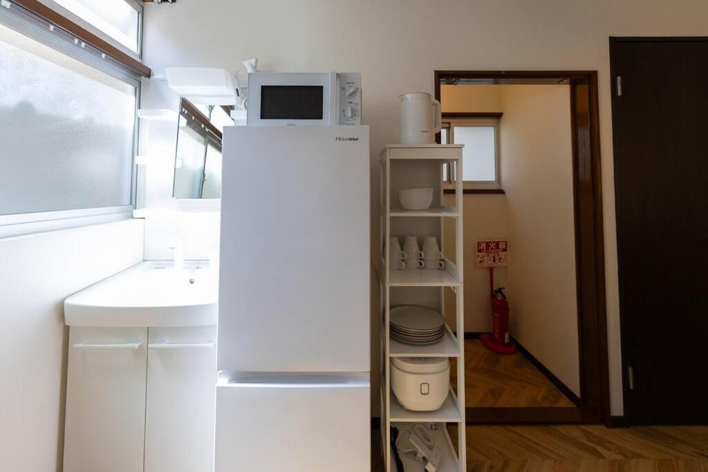 駐車場無料！静かな住宅街　５つの寝室でご家族でゆっくりお過ごし頂けます　7台の寝具で最大14名様まで Villa